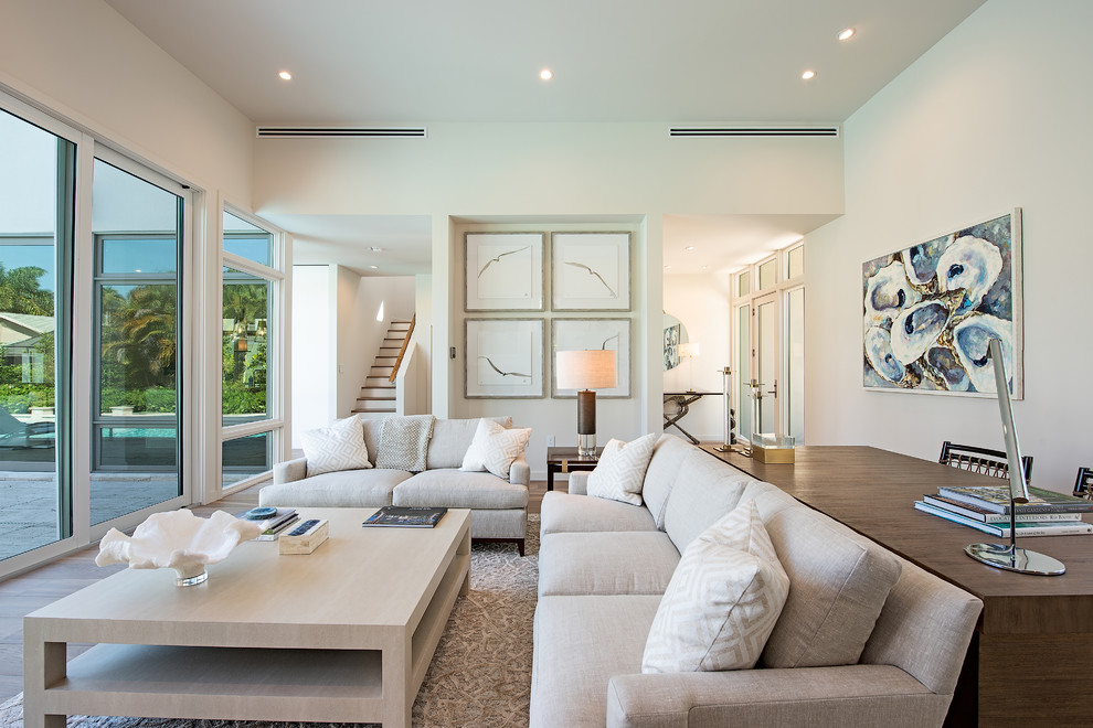 Photo of a transitional formal living room in Miami with white walls.