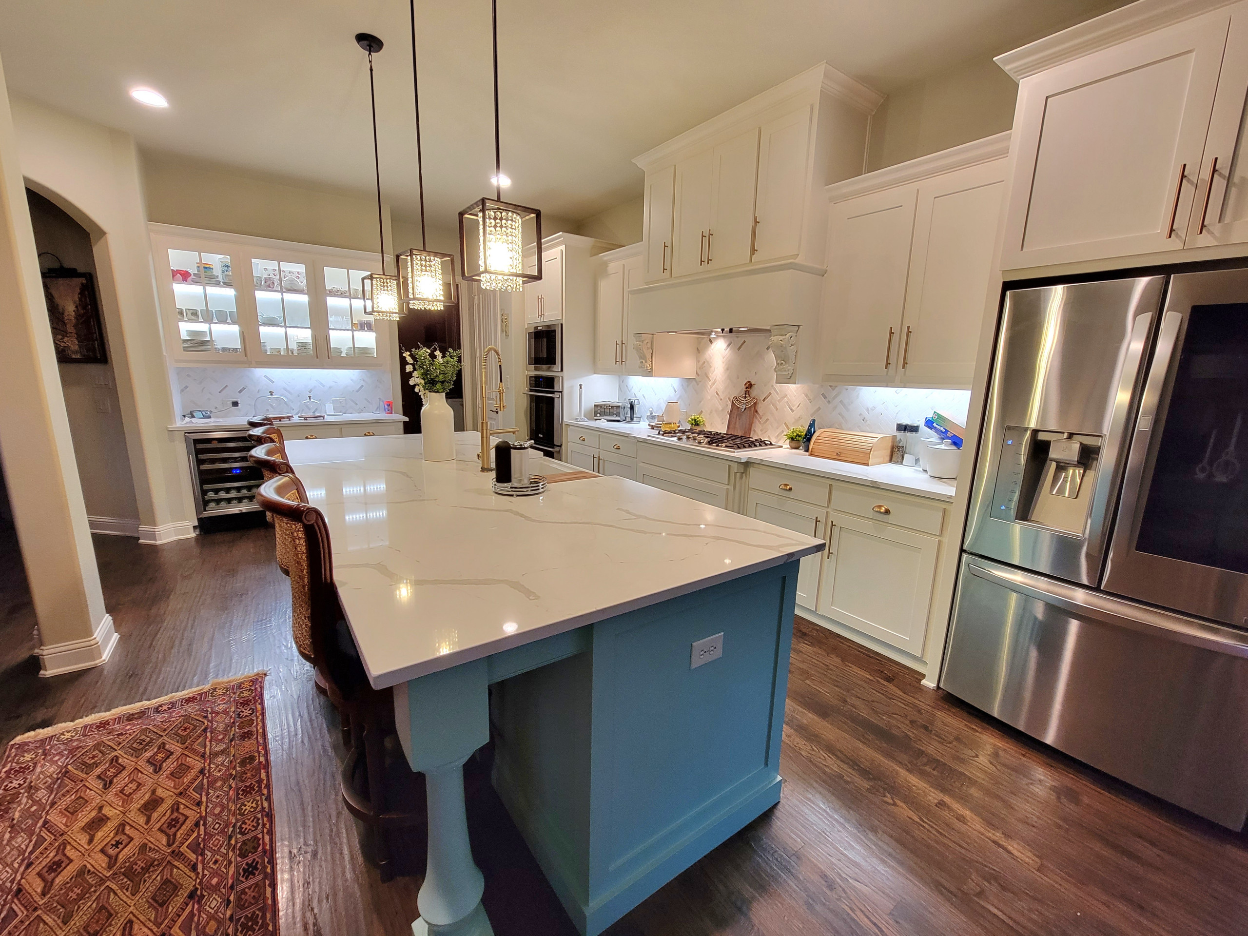 New doors and drawers Shaker style,  new countertop.  New lighting,  two colors refinishing