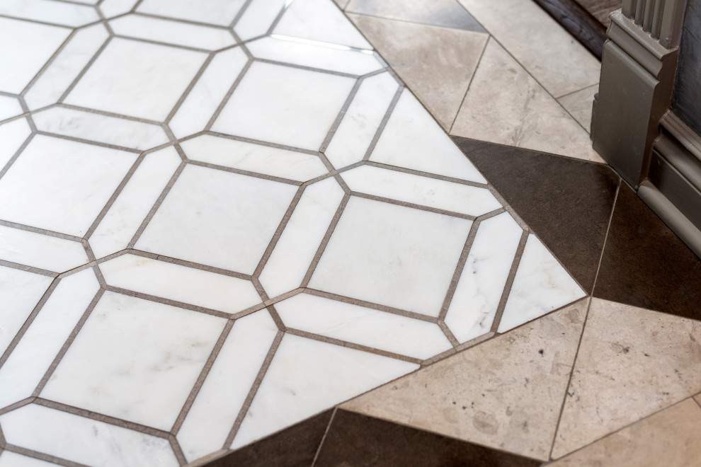 Example of a mid-sized transitional marble floor and white floor foyer design