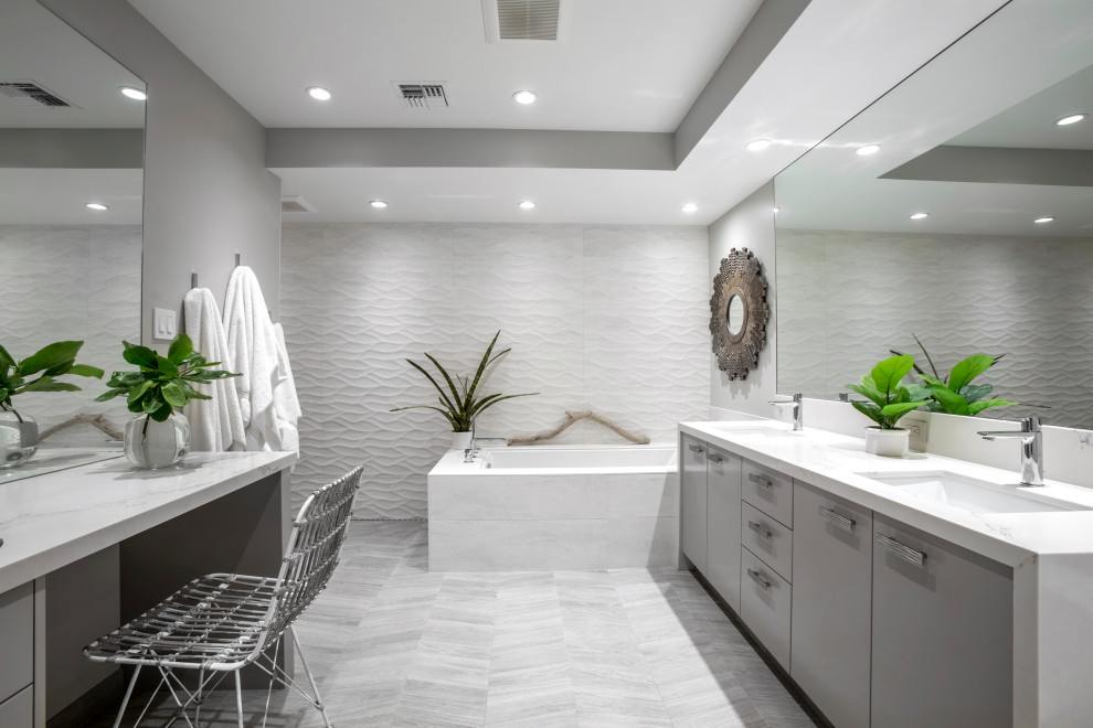 Minimalist double-sink bathroom photo in Hawaii with gray cabinets
