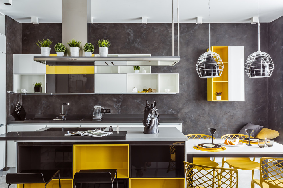 Mid-sized contemporary galley open plan kitchen in Other with open cabinets, yellow cabinets, quartzite benchtops, grey splashback, ceramic floors, with island, grey floor and white benchtop.