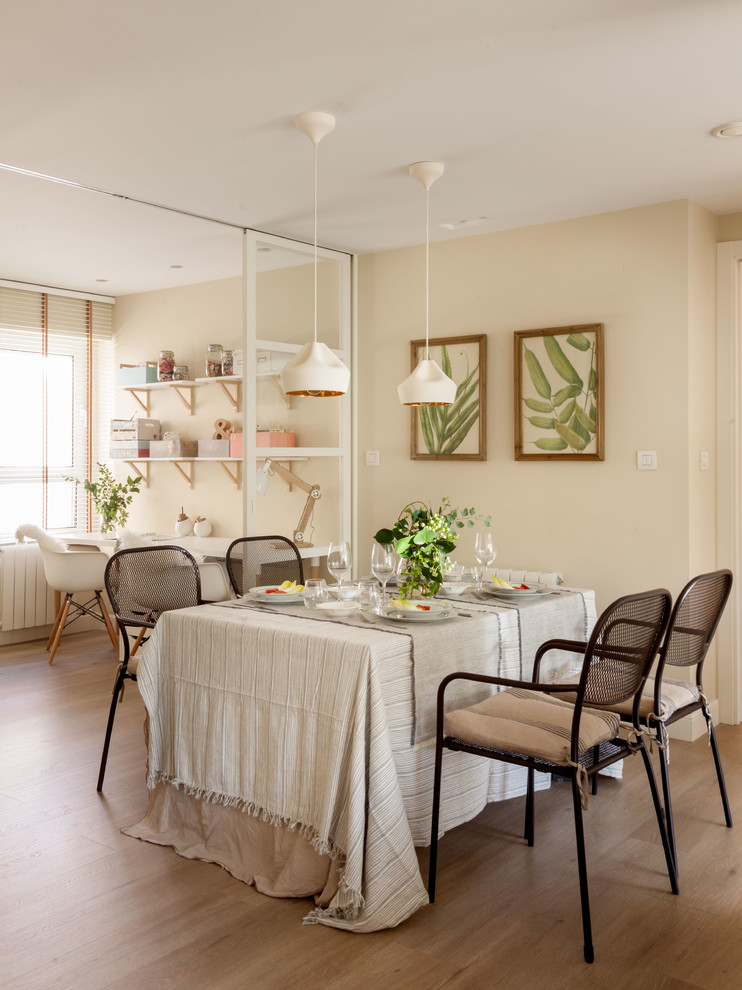 Design ideas for a mid-sized transitional open plan dining in Bilbao with beige walls.