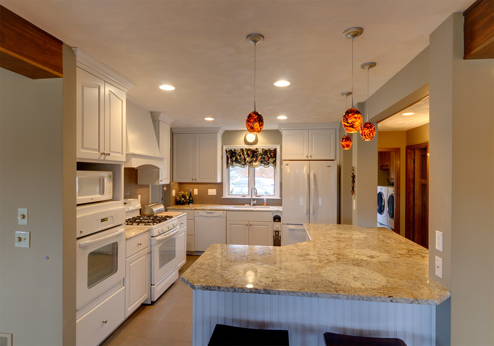 Eat-in kitchen - mid-sized transitional u-shaped medium tone wood floor and beige floor eat-in kitchen idea in Chicago with a drop-in sink, raised-panel cabinets, white cabinets, wood countertops, beige backsplash, stone slab backsplash, no island and white appliances