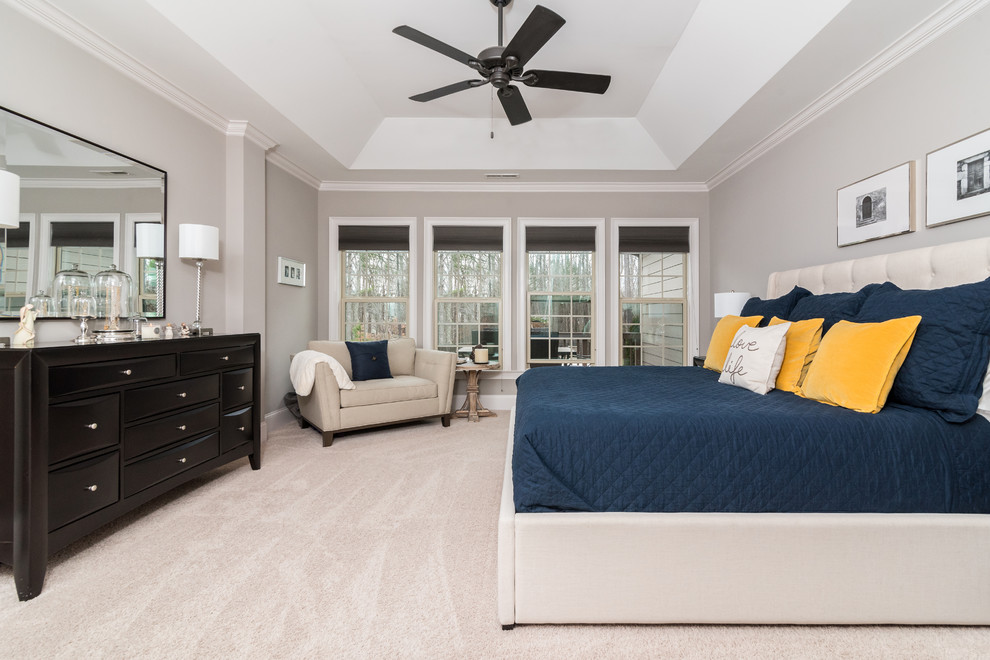 Design ideas for a large transitional master bedroom in Charlotte with grey walls, carpet, no fireplace and beige floor.