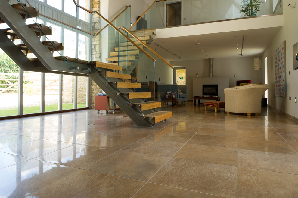This is an example of a modern entryway in Oxfordshire with porcelain floors and brown floor.