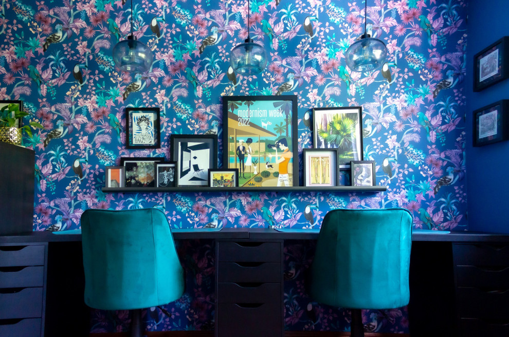 Inspiration for a mid-sized tropical craft room in San Diego with blue walls, medium hardwood floors and a freestanding desk.
