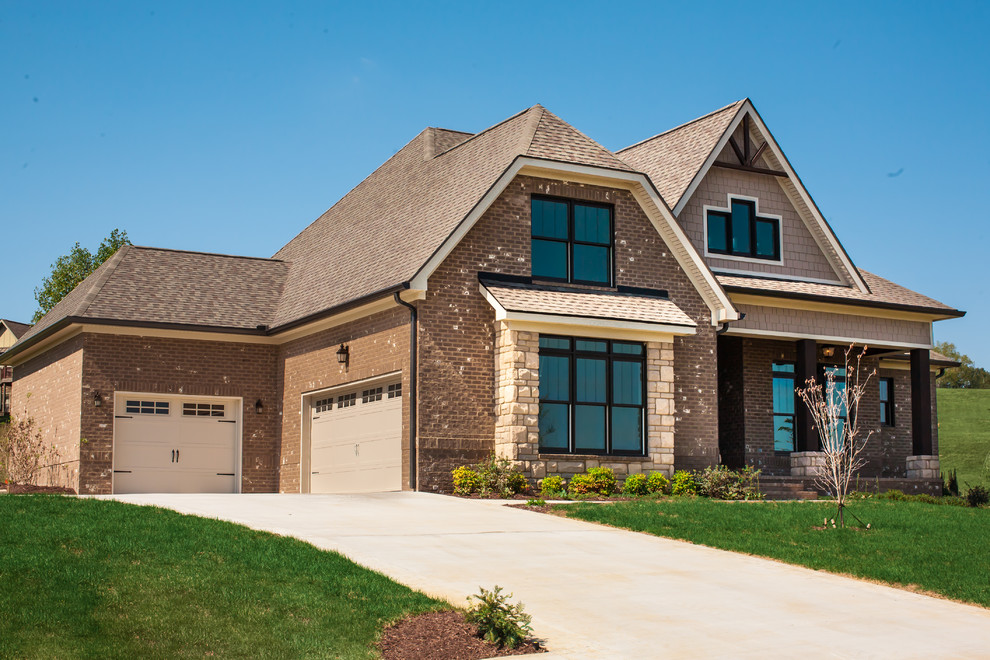 Example of a large arts and crafts brown two-story mixed siding gable roof design with a shingle roof