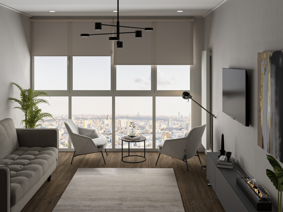 Зона гостиной с ТВ, камином и зоной отдыха у панорамного окна