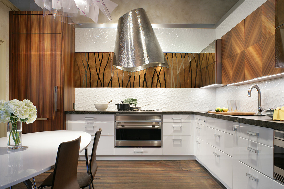 This is an example of a mid-sized contemporary l-shaped eat-in kitchen in New York with no island, flat-panel cabinets, an undermount sink, brown cabinets, white splashback, stainless steel appliances, medium hardwood floors and concrete benchtops.