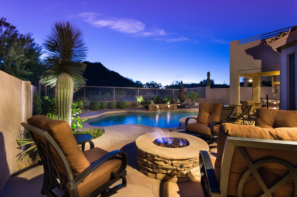 Pool - large backyard custom-shaped natural pool idea in Phoenix