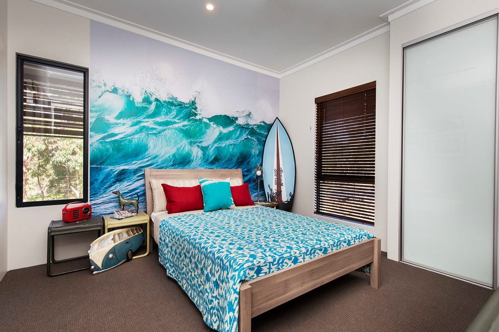 Inspiration for a mid-sized beach style guest bedroom in Perth with white walls and carpet.