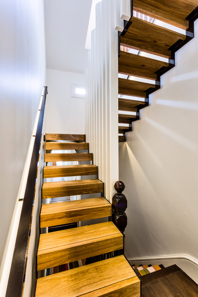 Design ideas for a mid-sized contemporary wood straight staircase in Sydney with wood risers.