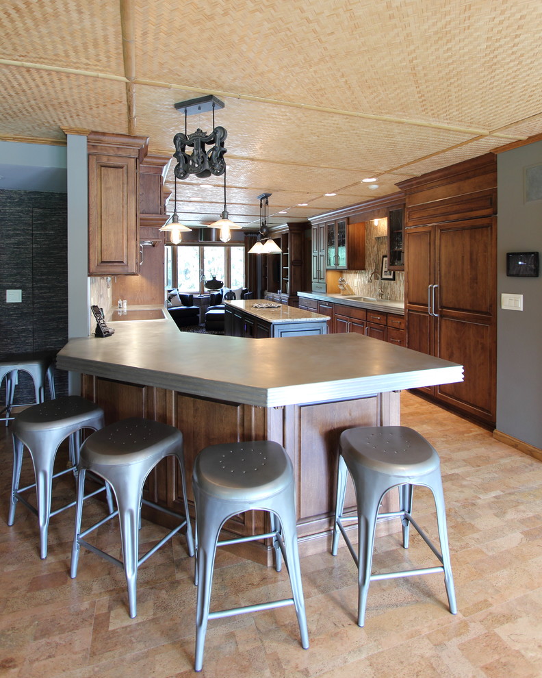 Large transitional cork floor kitchen photo with raised-panel cabinets, medium tone wood cabinets, glass tile backsplash and an island