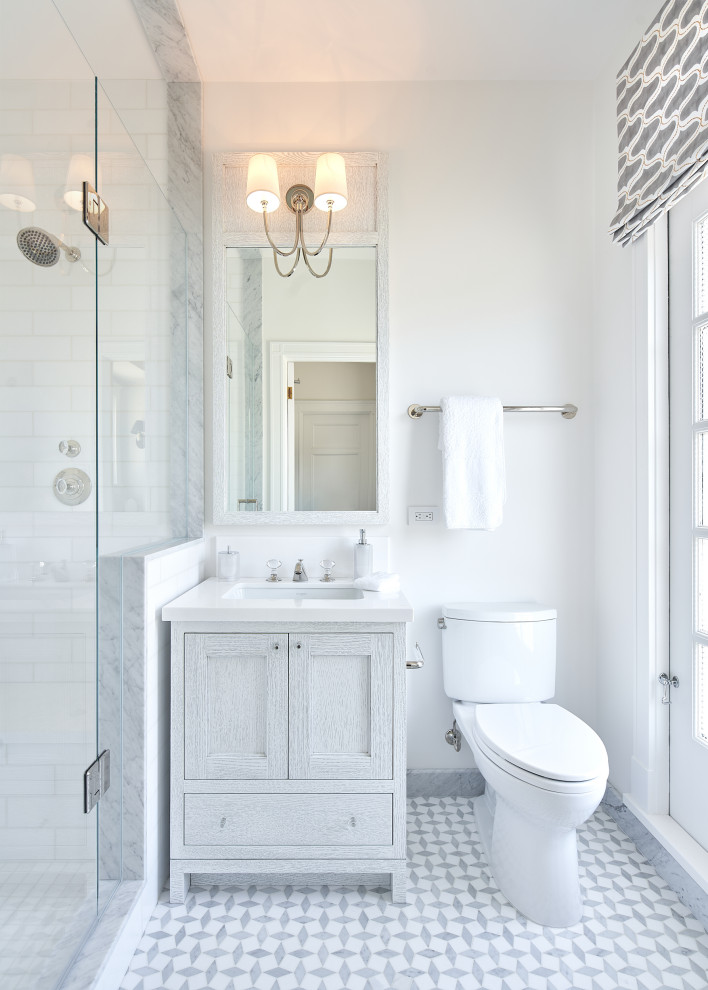 Design ideas for a transitional bathroom in San Francisco with shaker cabinets, grey cabinets, an alcove shower, white tile, white walls, an undermount sink, grey floor, a hinged shower door, white benchtops, a single vanity and a freestanding vanity.