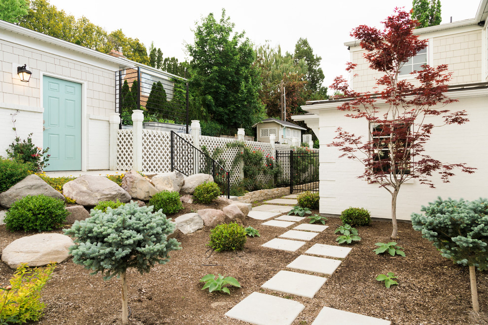 Inspiration for a transitional side yard garden in Salt Lake City with with raised garden bed and concrete pavers.