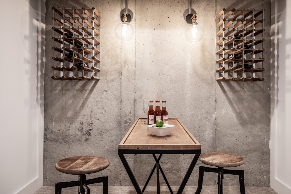 Design ideas for an industrial wine cellar in Indianapolis with concrete floors, storage racks and grey floor.