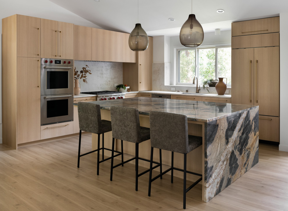 Design ideas for a mid-sized contemporary kitchen in Minneapolis with a double-bowl sink, flat-panel cabinets, light wood cabinets, quartzite benchtops, beige splashback, engineered quartz splashback, stainless steel appliances, light hardwood floors, with island, beige floor and beige benchtop.