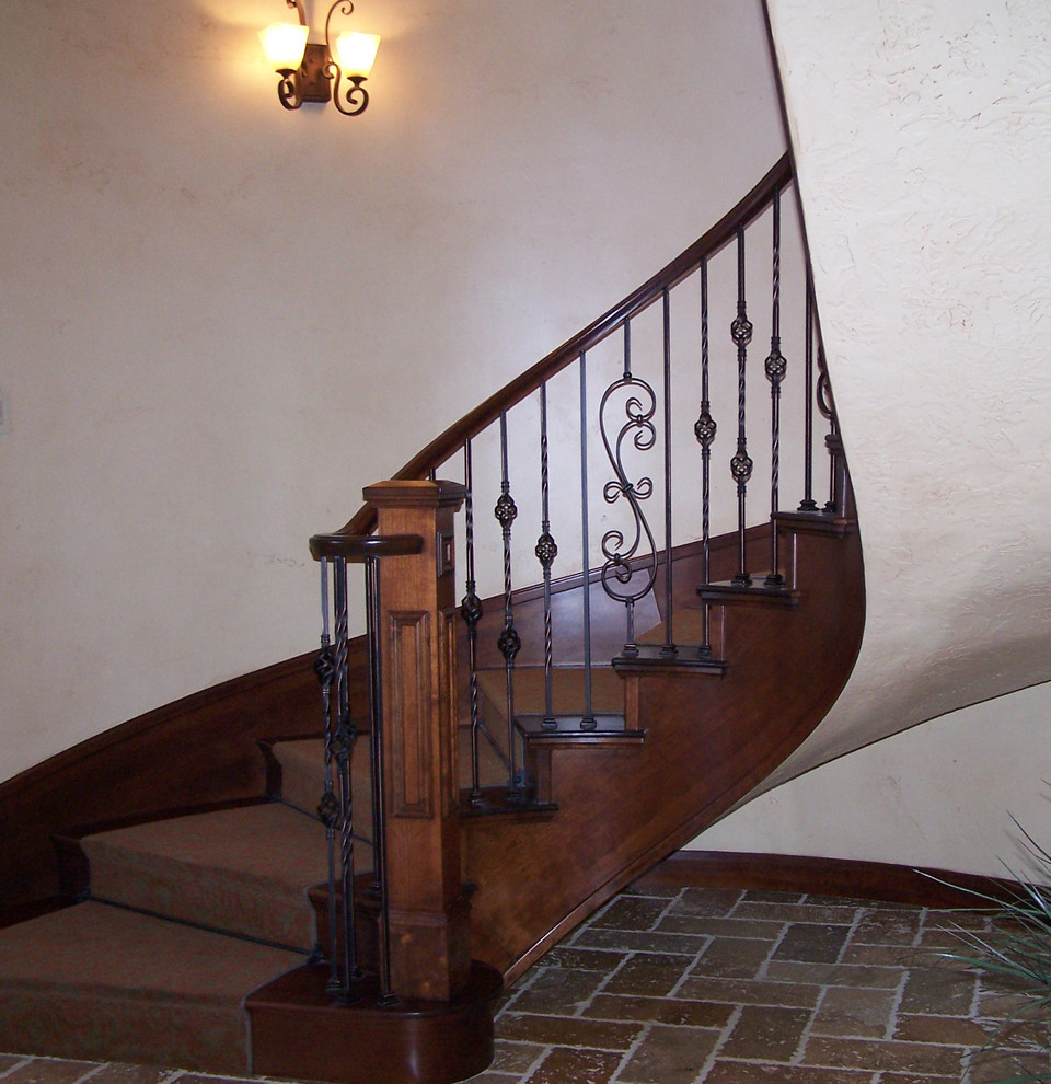Example of a large classic wooden curved staircase design in Salt Lake City with wooden risers