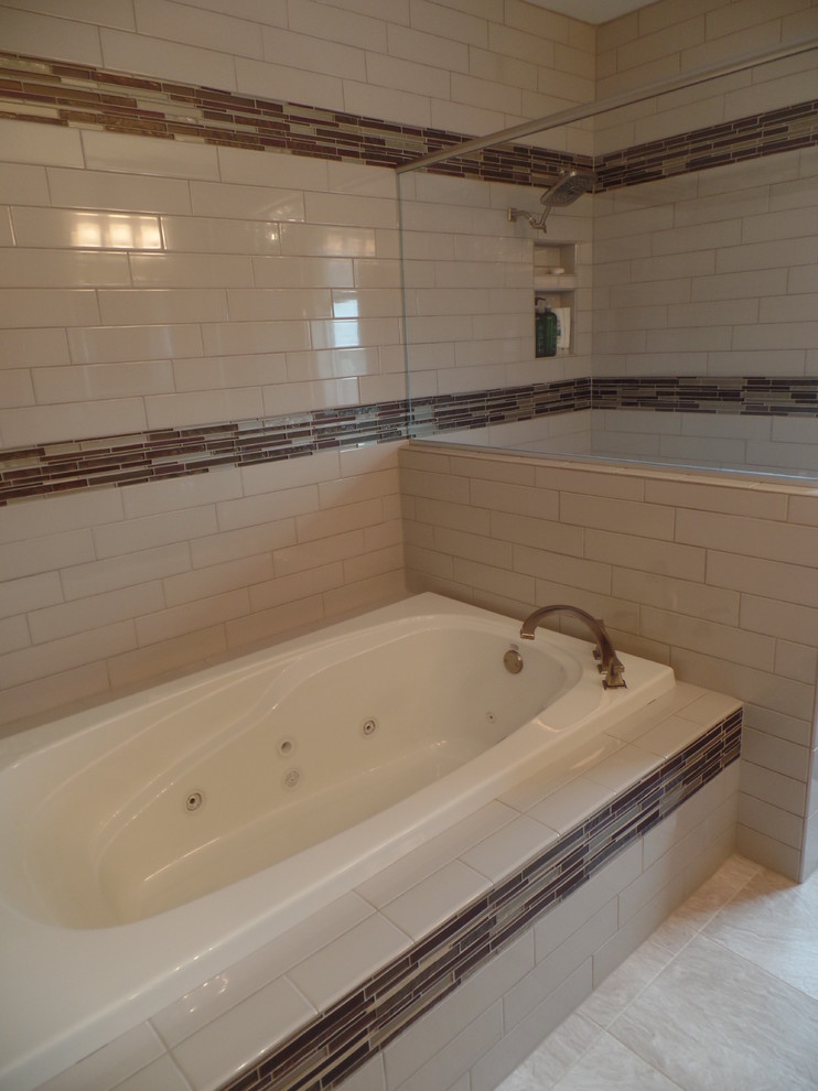Inspiration for a mid-sized transitional 3/4 porcelain tile and beige floor bathroom remodel in Cedar Rapids with shaker cabinets, dark wood cabinets, a two-piece toilet, beige walls, an integrated sink and quartz countertops