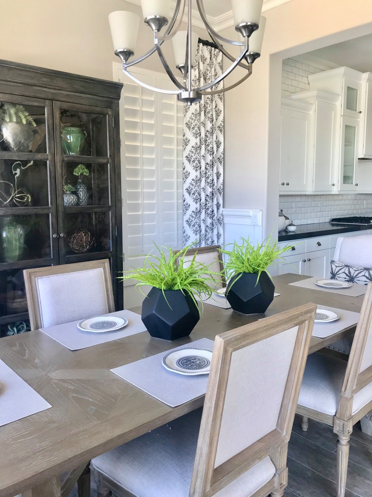 Example of a mid-sized transitional porcelain tile and gray floor kitchen/dining room combo design in Phoenix with gray walls