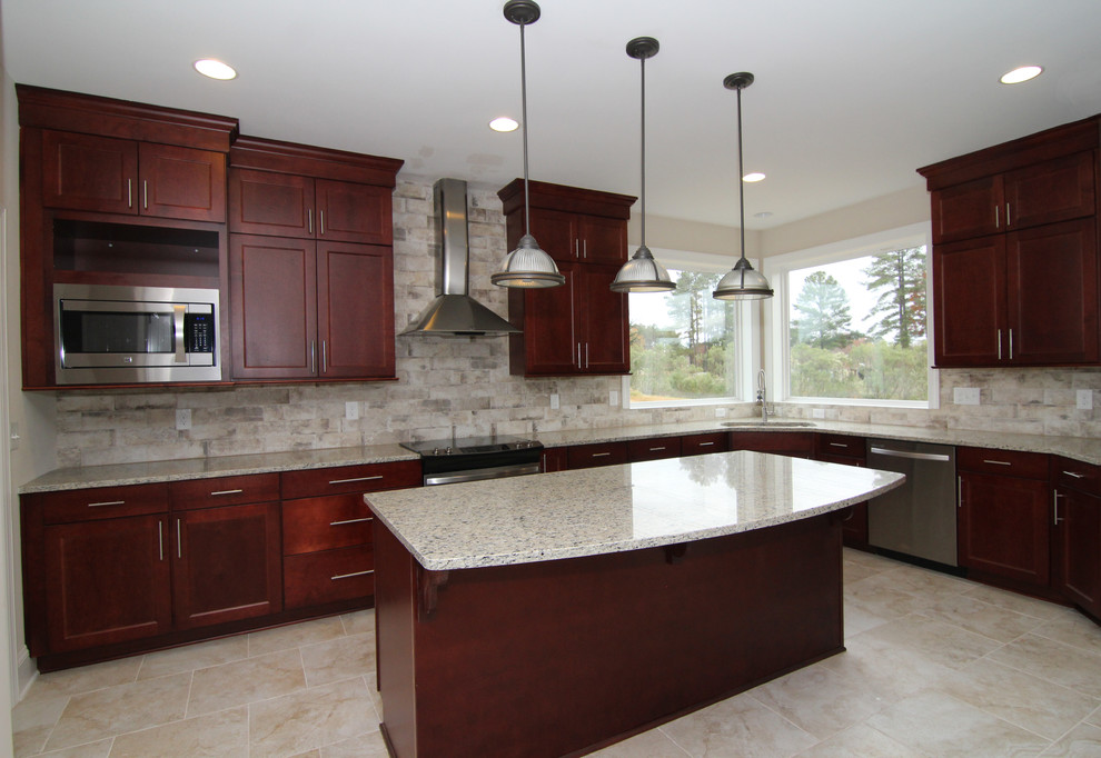 Photo of a large contemporary l-shaped open plan kitchen in Raleigh with an undermount sink, shaker cabinets, red cabinets, granite benchtops, grey splashback, ceramic splashback, stainless steel appliances, ceramic floors and with island.