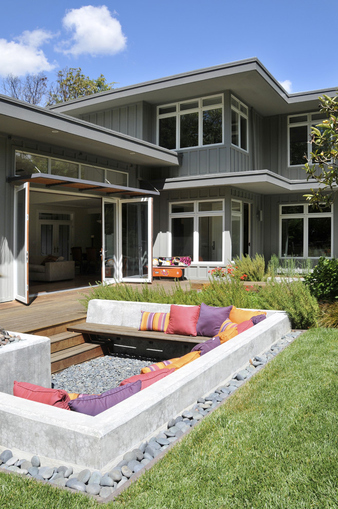 Design ideas for a contemporary backyard patio in San Francisco with a fire feature, decking and no cover.