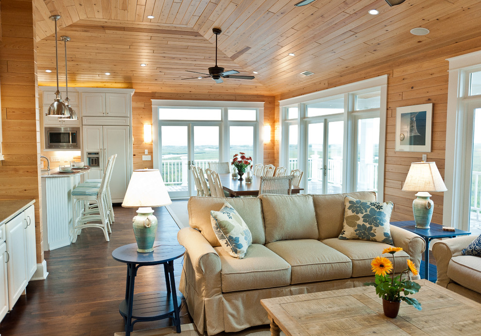 Country open concept living room in Other with dark hardwood floors.