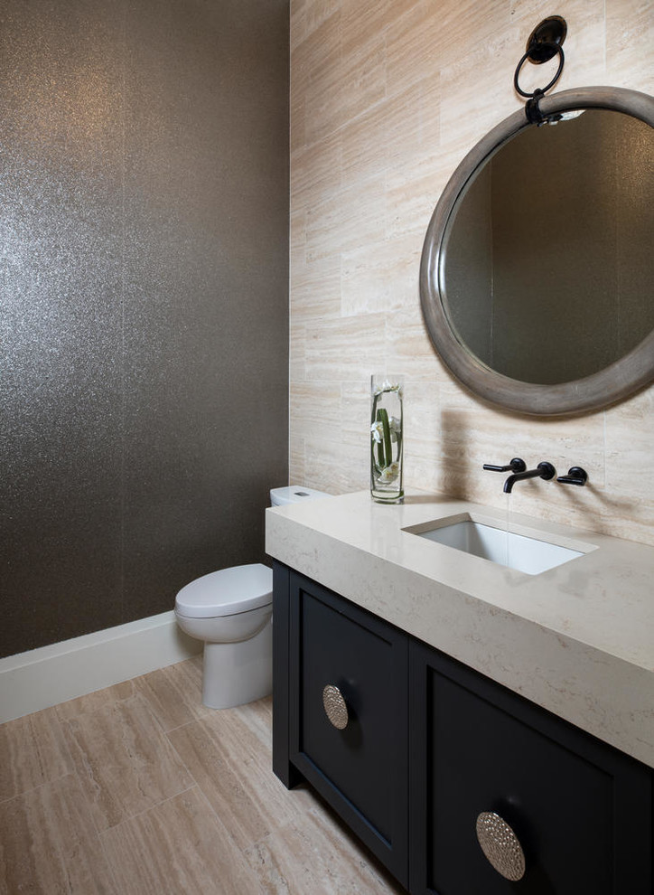Photo of a small modern 3/4 bathroom in Miami with shaker cabinets, black cabinets, a one-piece toilet, beige tile, travertine, grey walls, travertine floors, an undermount sink, engineered quartz benchtops, beige floor and beige benchtops.