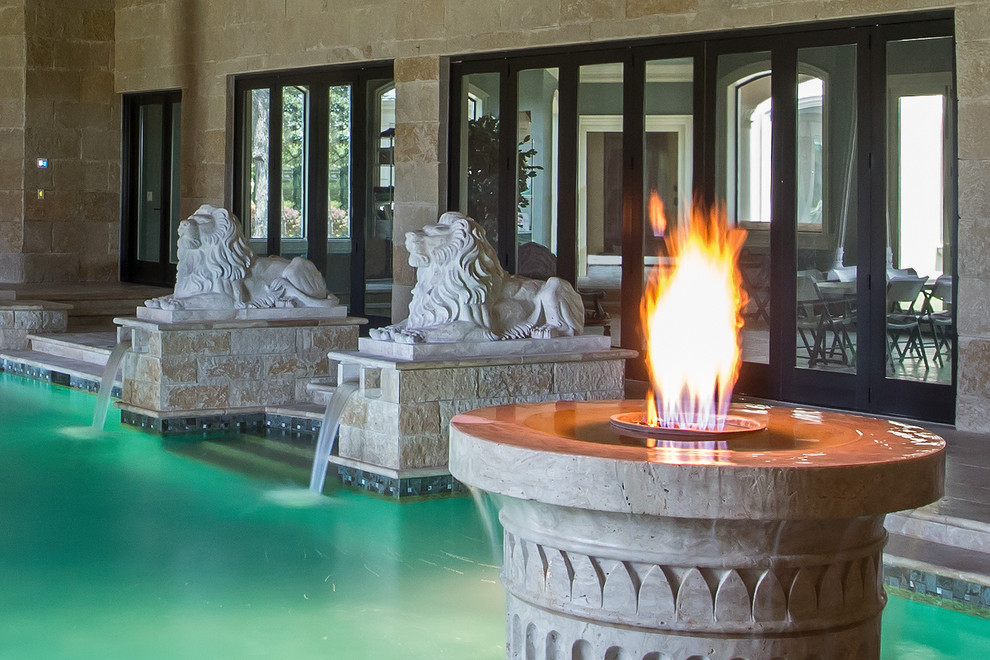 Pool - large mediterranean indoor stone and rectangular pool idea in Dallas