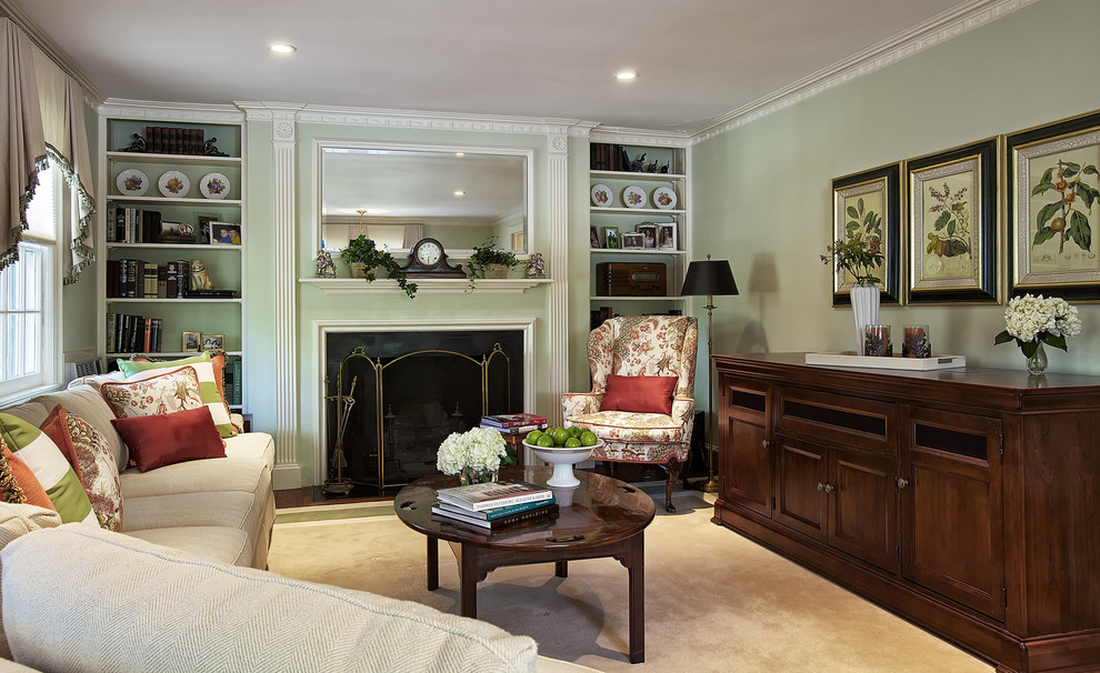 This is an example of a traditional family room in New York with green walls and brown floor.