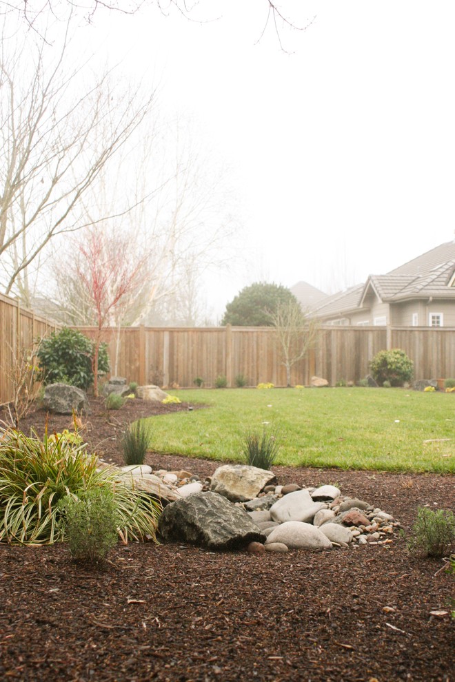 Mid-sized arts and crafts backyard partial sun garden in Other with a water feature and concrete pavers for winter.