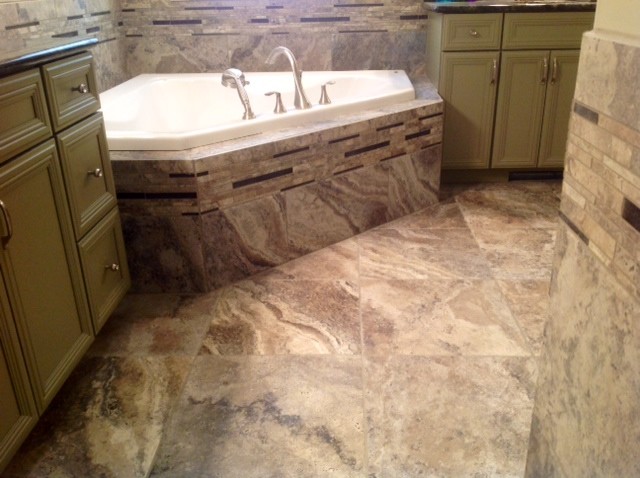 This is an example of a mid-sized transitional bathroom in Other with a corner tub, brown tile, porcelain tile and porcelain floors.