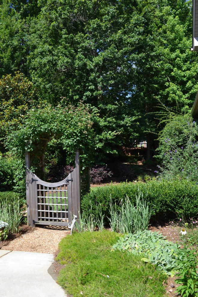 Photo of a traditional backyard garden in Charlotte.