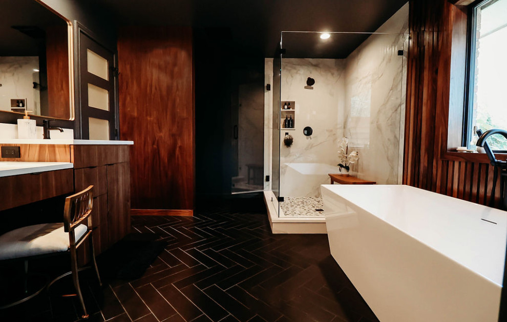 Inspiration for a mid-sized modern master bathroom in Dallas with flat-panel cabinets, medium wood cabinets, a freestanding tub, a corner shower, white tile, porcelain tile, black walls, porcelain floors, an undermount sink, engineered quartz benchtops, black floor, a hinged shower door, white benchtops, a shower seat, a double vanity, a floating vanity and wood walls.