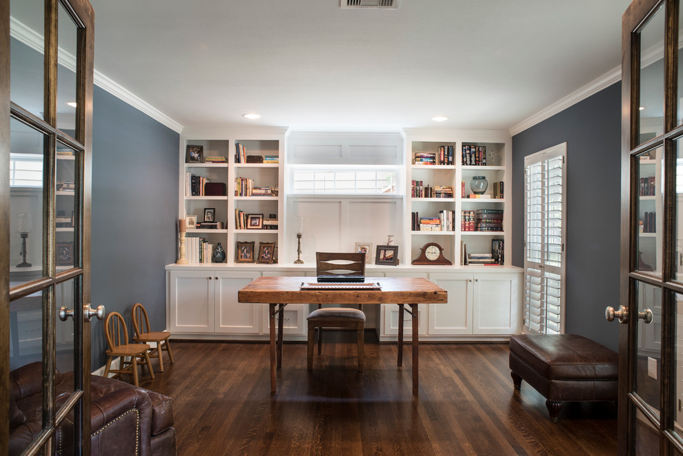 Inspiration for a large traditional study room in Houston with blue walls, medium hardwood floors and a freestanding desk.