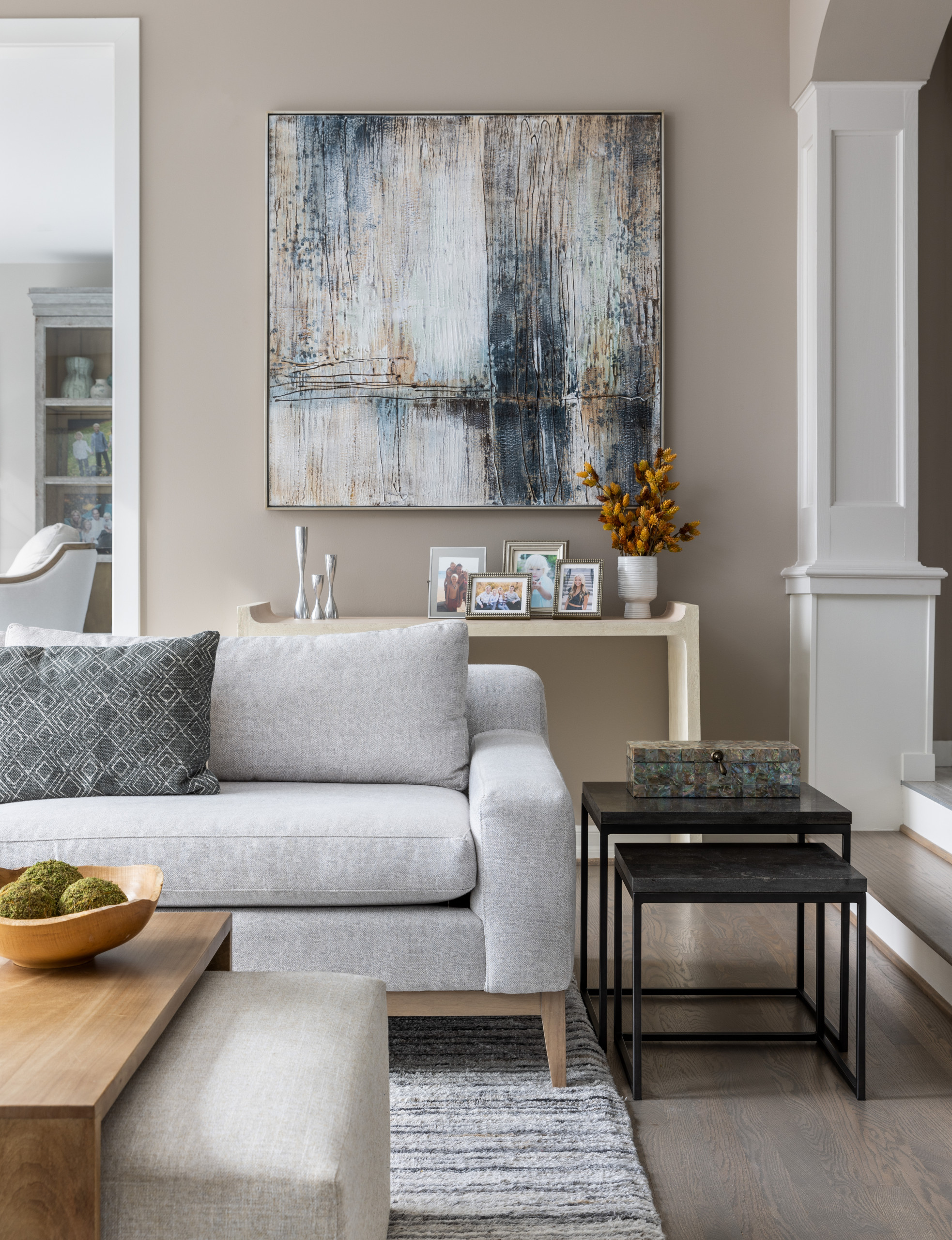 This cozy living room renovation, completed in the summer of 2021, was the perfect update for a busy family of six. Located on Long Lake, just north of Metro Detroit, this space sits just off the pool