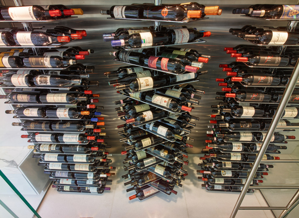 Design ideas for a modern wine cellar in Miami with display racks.