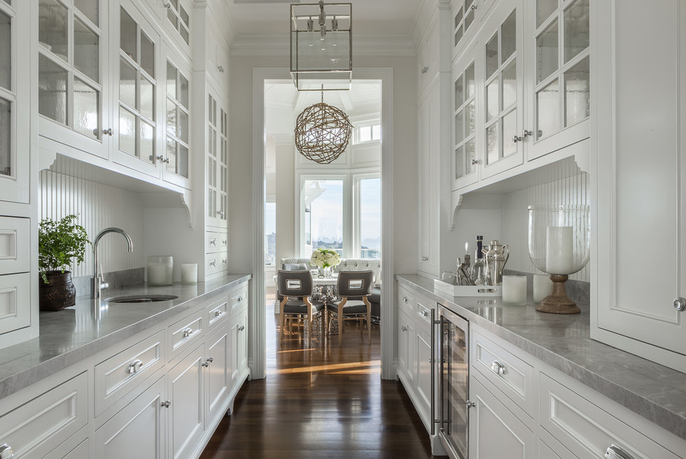 Design ideas for a large transitional galley kitchen pantry in San Francisco with no island, a single-bowl sink, recessed-panel cabinets, white cabinets, white splashback, stainless steel appliances and dark hardwood floors.