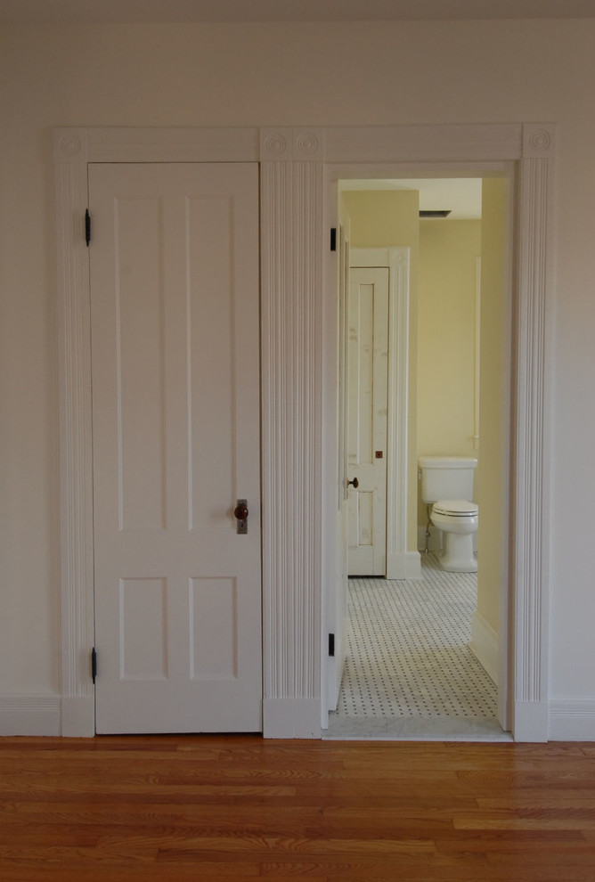 Photo of a large traditional master bathroom in Bridgeport with an alcove tub, a shower/bathtub combo, a one-piece toilet, yellow tile, ceramic tile, white walls, marble floors, a pedestal sink, multi-coloured floor and a shower curtain.
