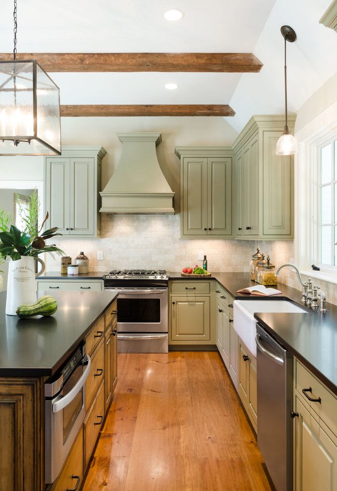 This is an example of a mid-sized country l-shaped separate kitchen in Boston with a farmhouse sink, beaded inset cabinets, distressed cabinets, granite benchtops, beige splashback, marble splashback, stainless steel appliances, medium hardwood floors, with island and orange floor.