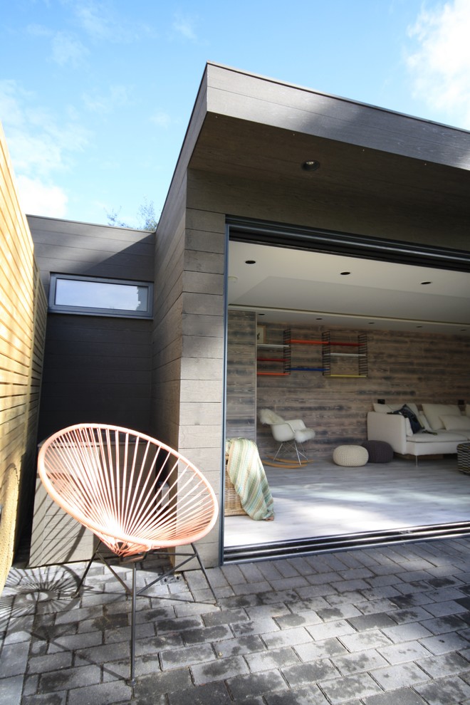 This is an example of a mid-sized contemporary detached studio in Surrey.