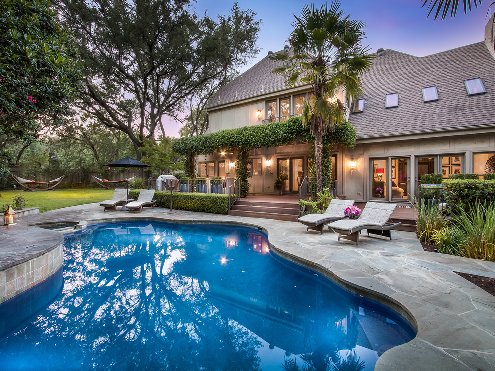 This is an example of a traditional backyard custom-shaped pool in Austin.