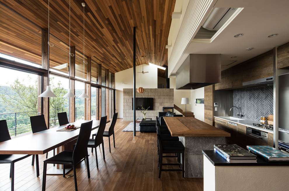Design ideas for a modern open plan dining in Kobe with white walls and medium hardwood floors.