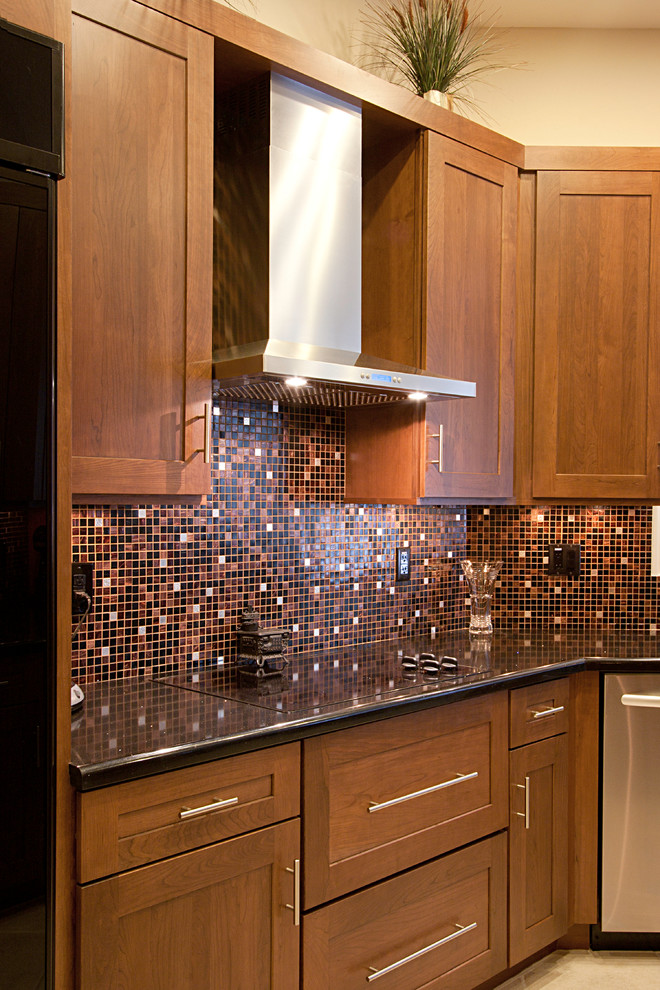 Large transitional ceramic tile eat-in kitchen photo in Phoenix with an undermount sink, flat-panel cabinets, dark wood cabinets, quartz countertops, multicolored backsplash, mosaic tile backsplash, black appliances and no island