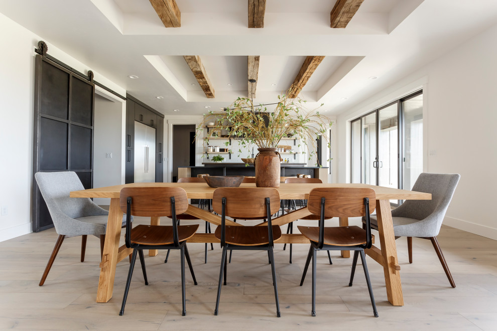 This is an example of a contemporary open plan dining room in Boise with white walls, light hardwood flooring, beige floors, exposed beams and a drop ceiling.