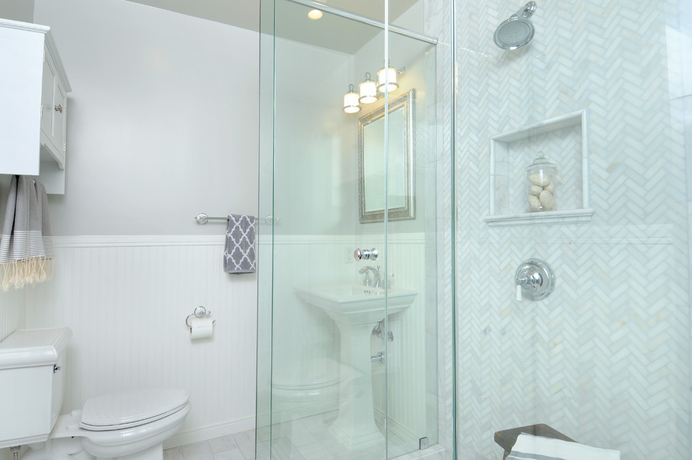 Bathroom - traditional stone tile bathroom idea in Los Angeles with a pedestal sink