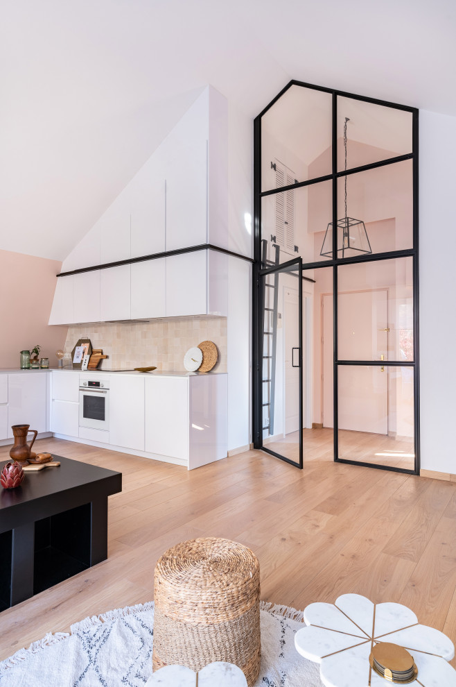 Design ideas for a large contemporary l-shaped open plan kitchen in Paris with an integrated sink, flat-panel cabinets, white cabinets, pink splashback, ceramic splashback, panelled appliances, light hardwood floors, no island and grey benchtop.
