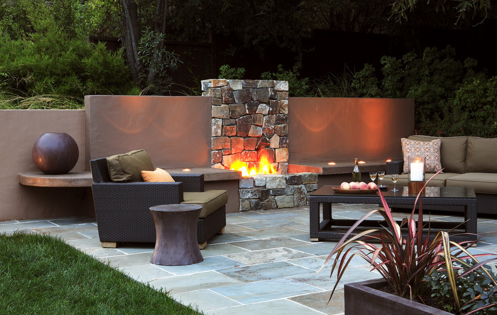 This is an example of a contemporary patio in San Francisco with a fire feature.
