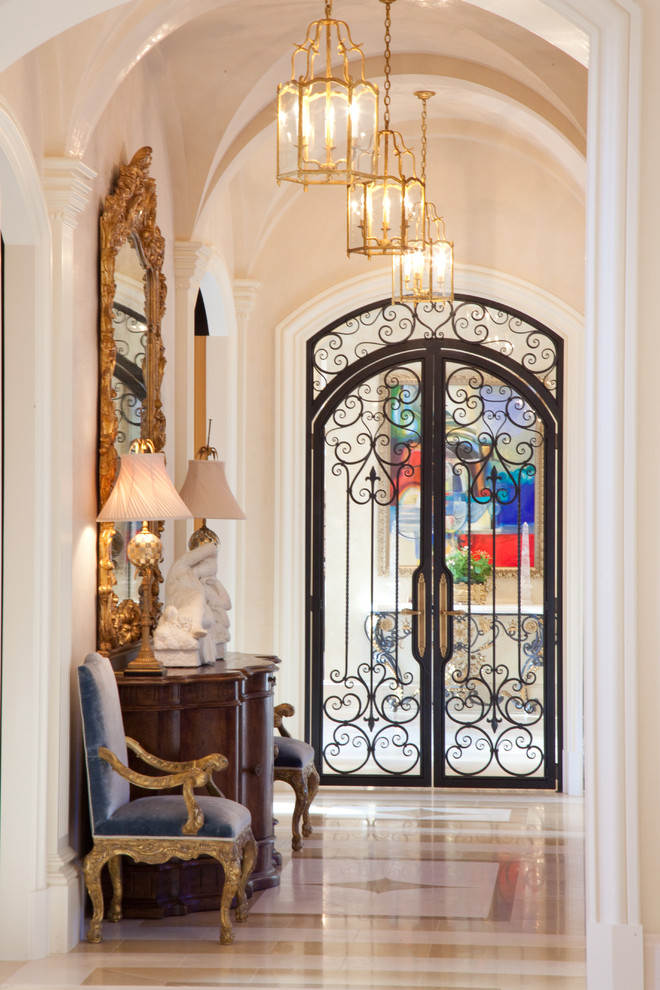 Mid-sized mediterranean entry hall in Chicago with a double front door, white walls and ceramic floors.