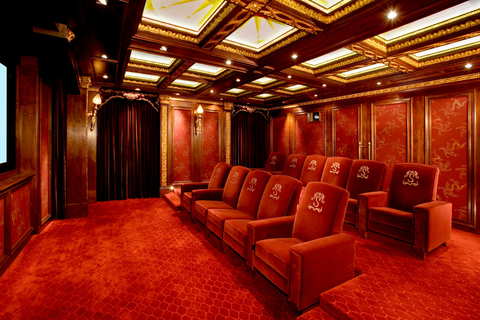 This is an example of a traditional home theatre in Austin with red floor.